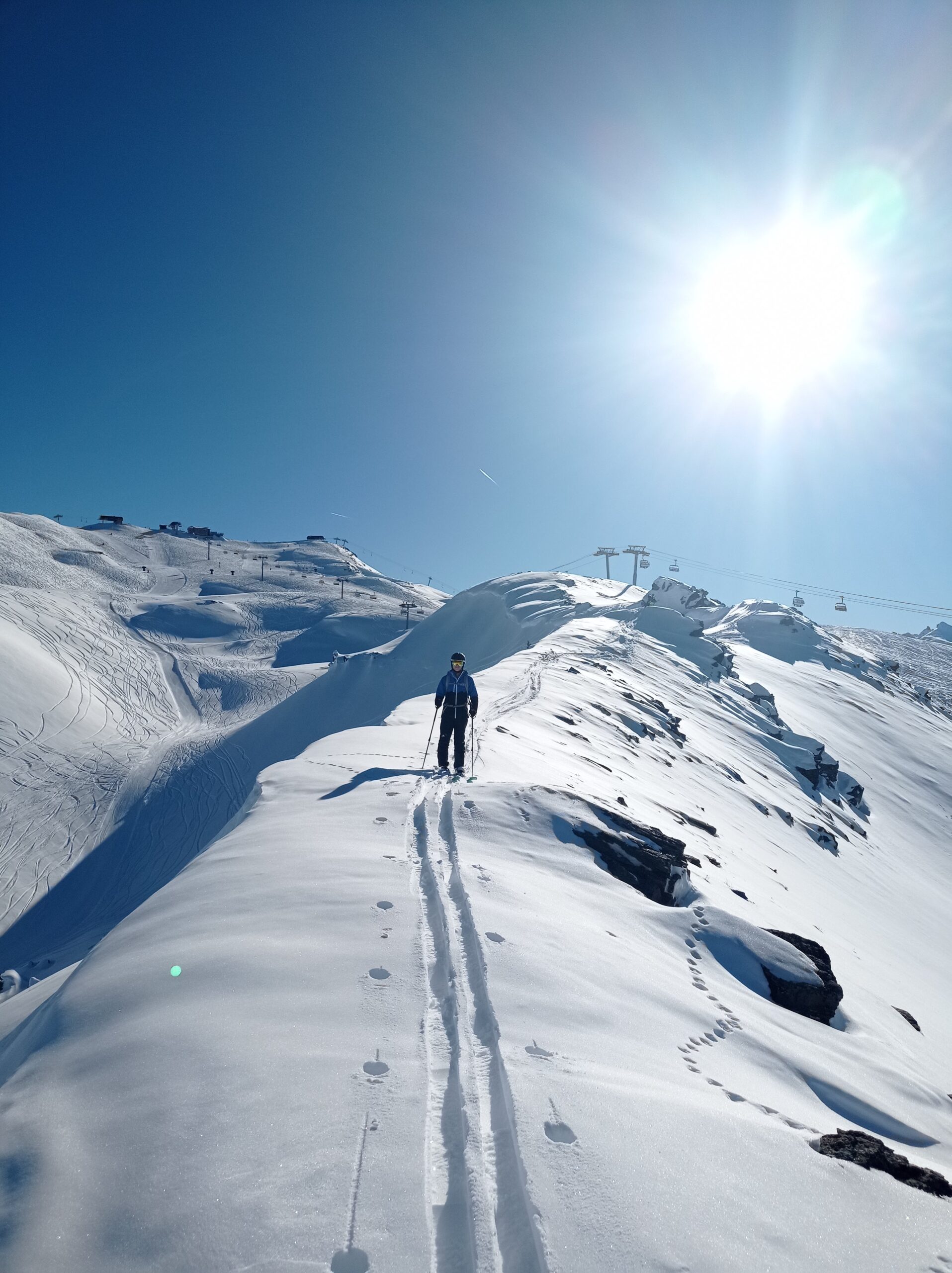 Hiking along the ridge with the Granges top station in the back ground.