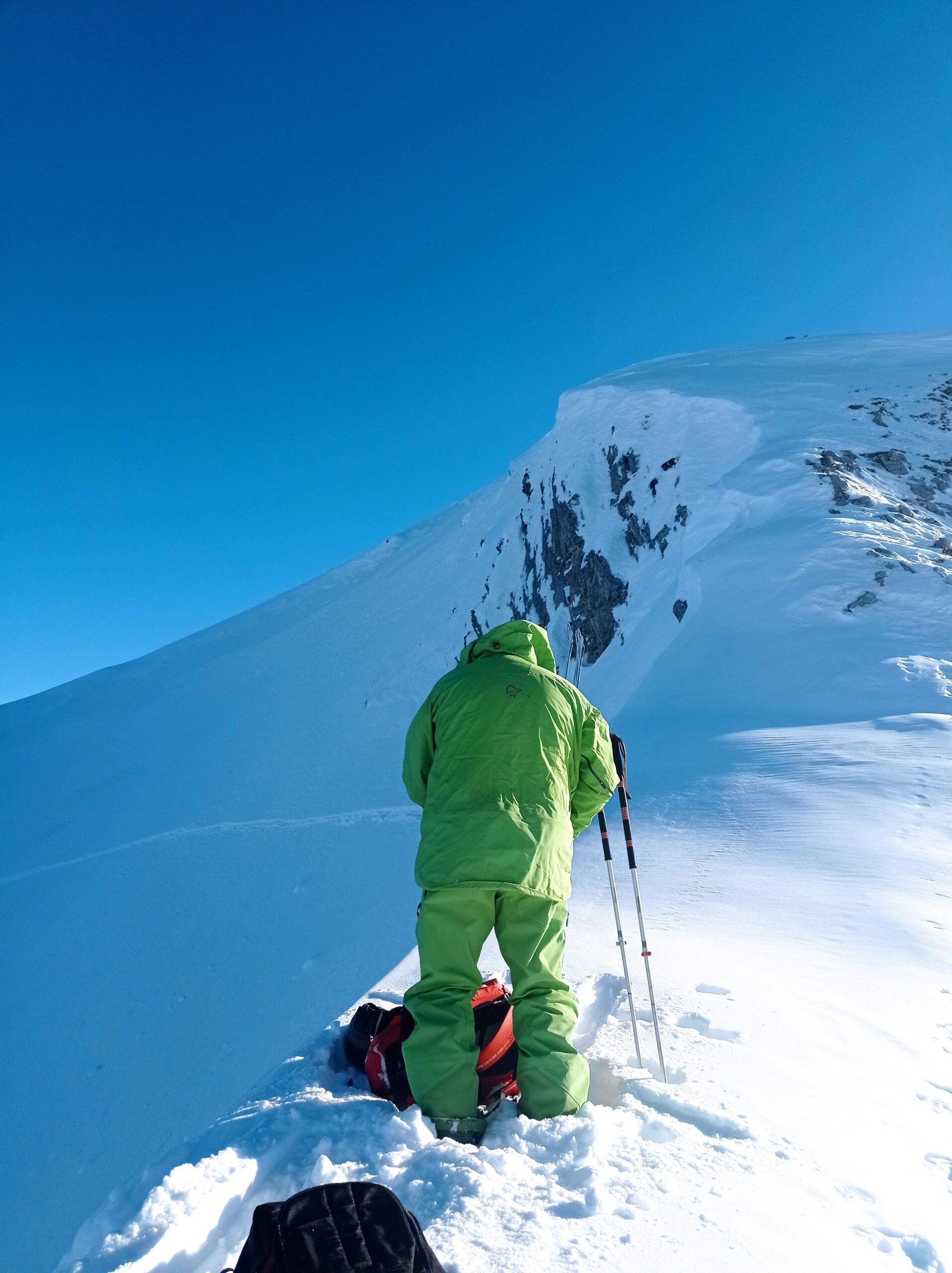 Transition on the ridge before dropping back through the cornice into the valley below.