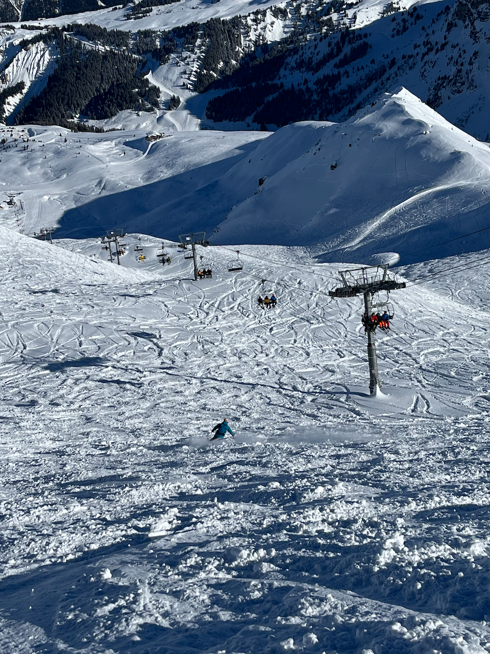 Options to riders right under the chair and back to the piste - early on or over the knoll in the middle distance. Or to stay left following the chair to more lines below.