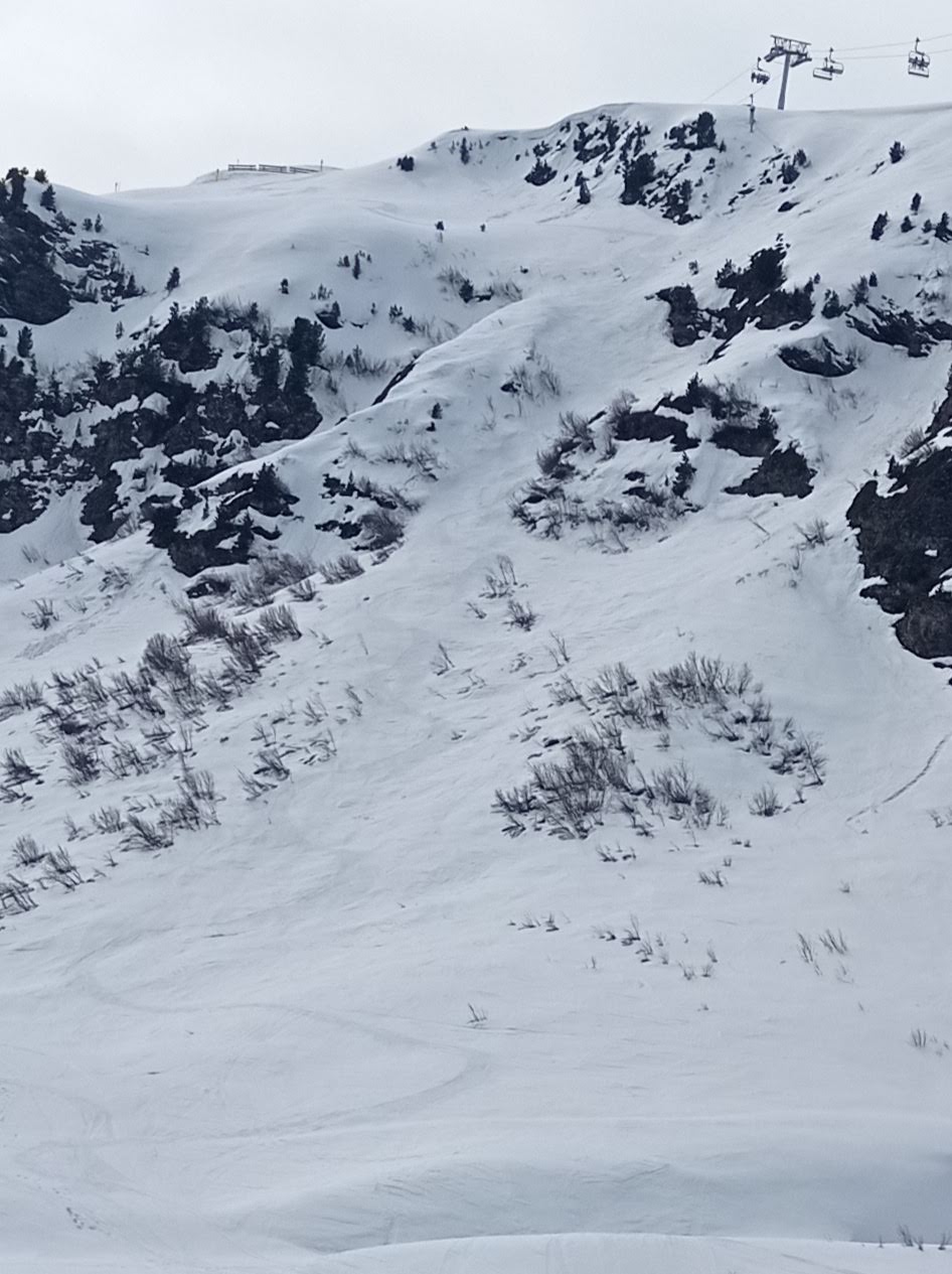 Looking back up the line. From the drop in track left and pick your couloir. You can scope your line as you ride up on the Cheferie chair which is visible top right in the photo.