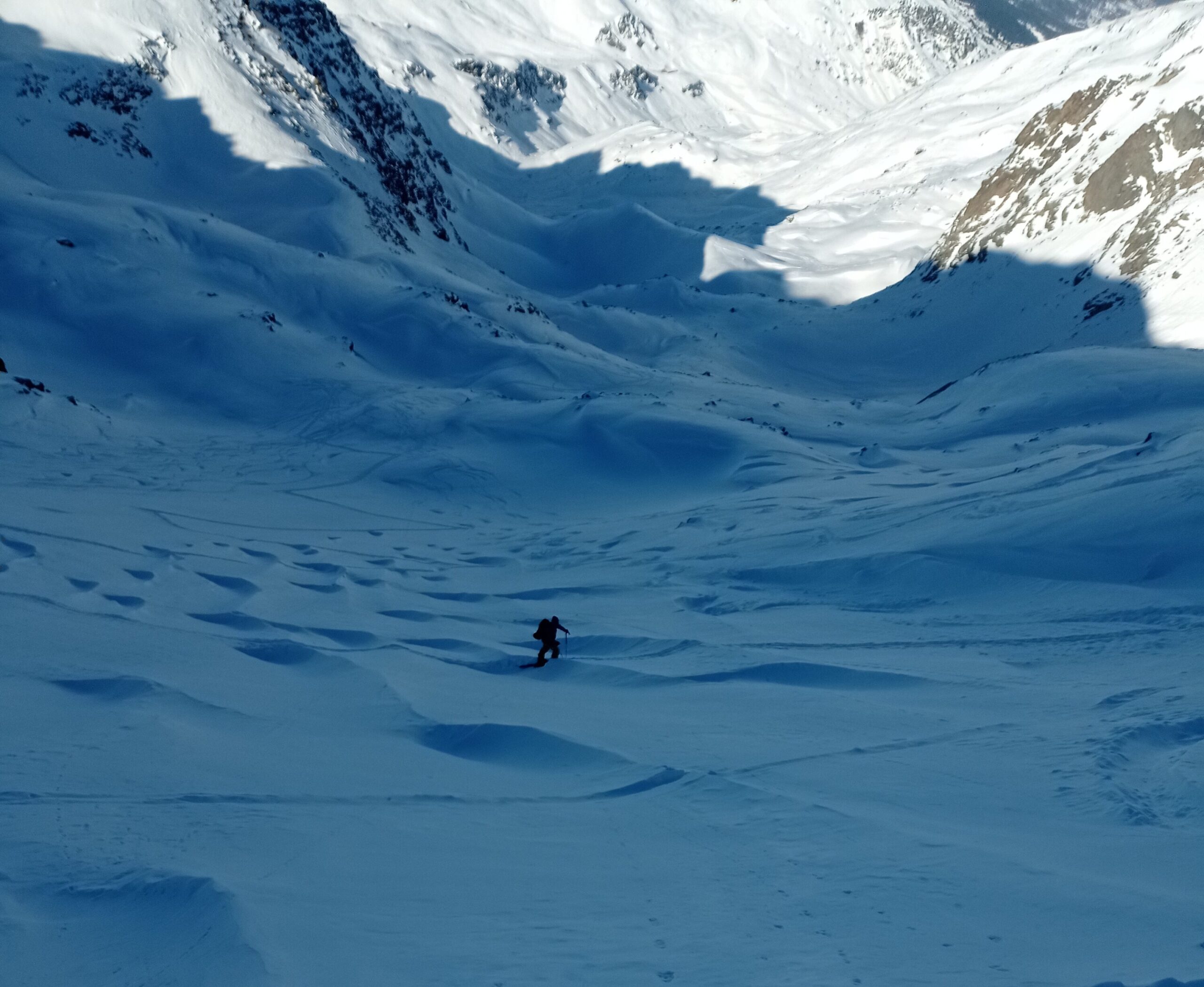 The last few kick turns up to the Col through a mystical wind affected snow field.