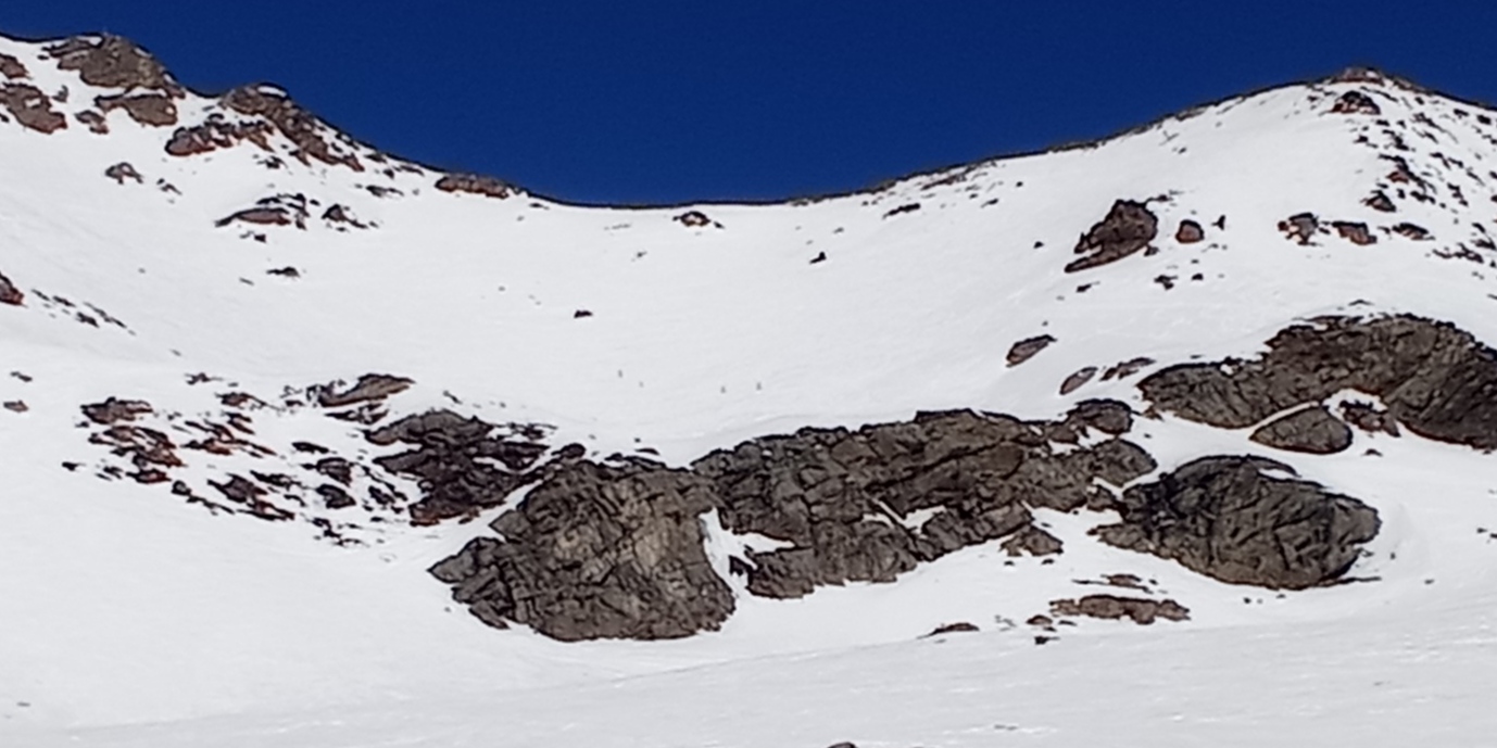 View of the Col from the Lory piste. Note the rock band you must navigate through.  