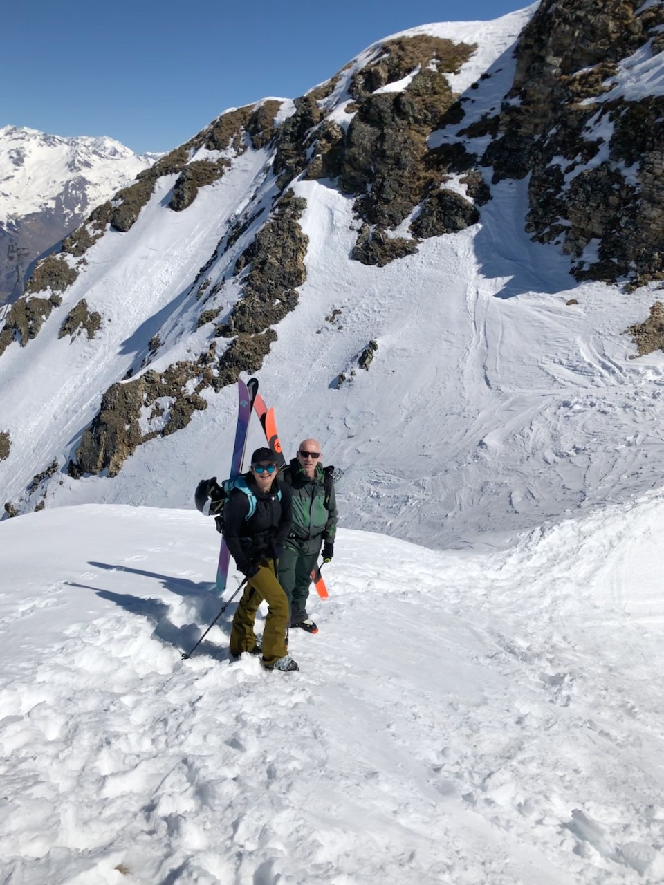 Time to transition / have a snack. (Note the saddle feature in the immediate background - turn riders left here into the couloir).  